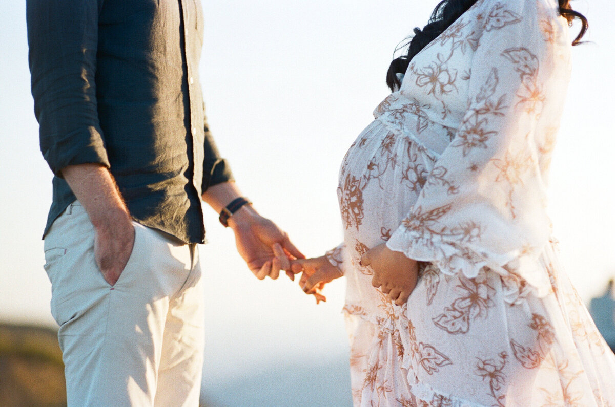 A tender scene from a maternity shoot within a Sydney family photography session