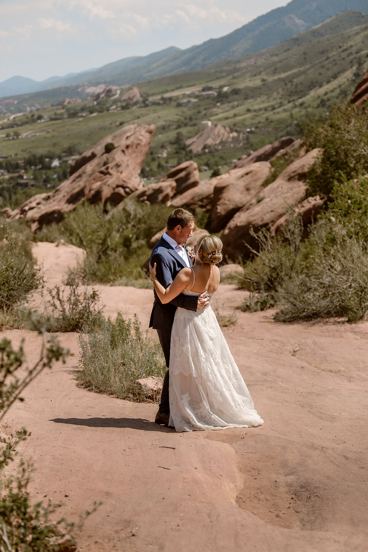 Heather and Doug happily hugging each other on their wedding day