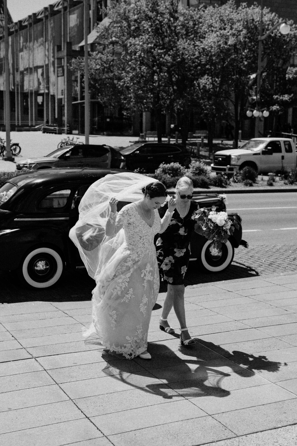 The bride and her mother approaching Notre Dame Basilica for the wedding ceremony
