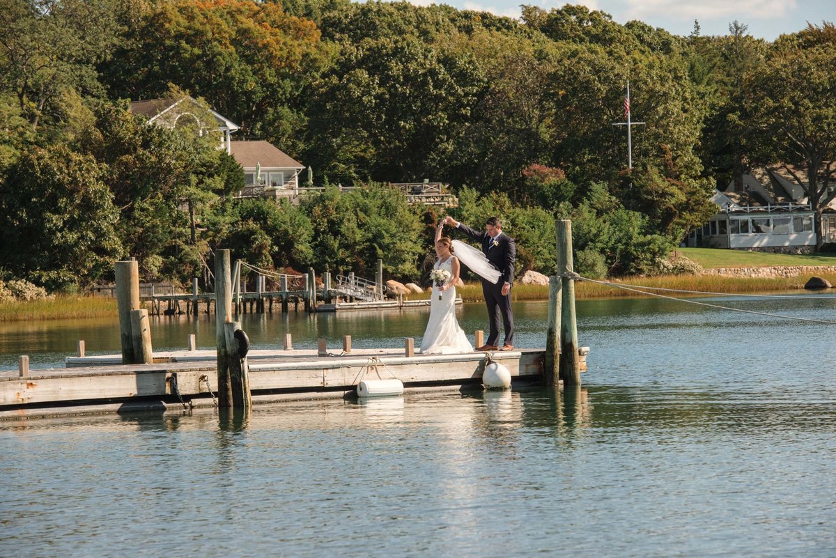 Bride and groom on the dock at The Ram's Head Inn