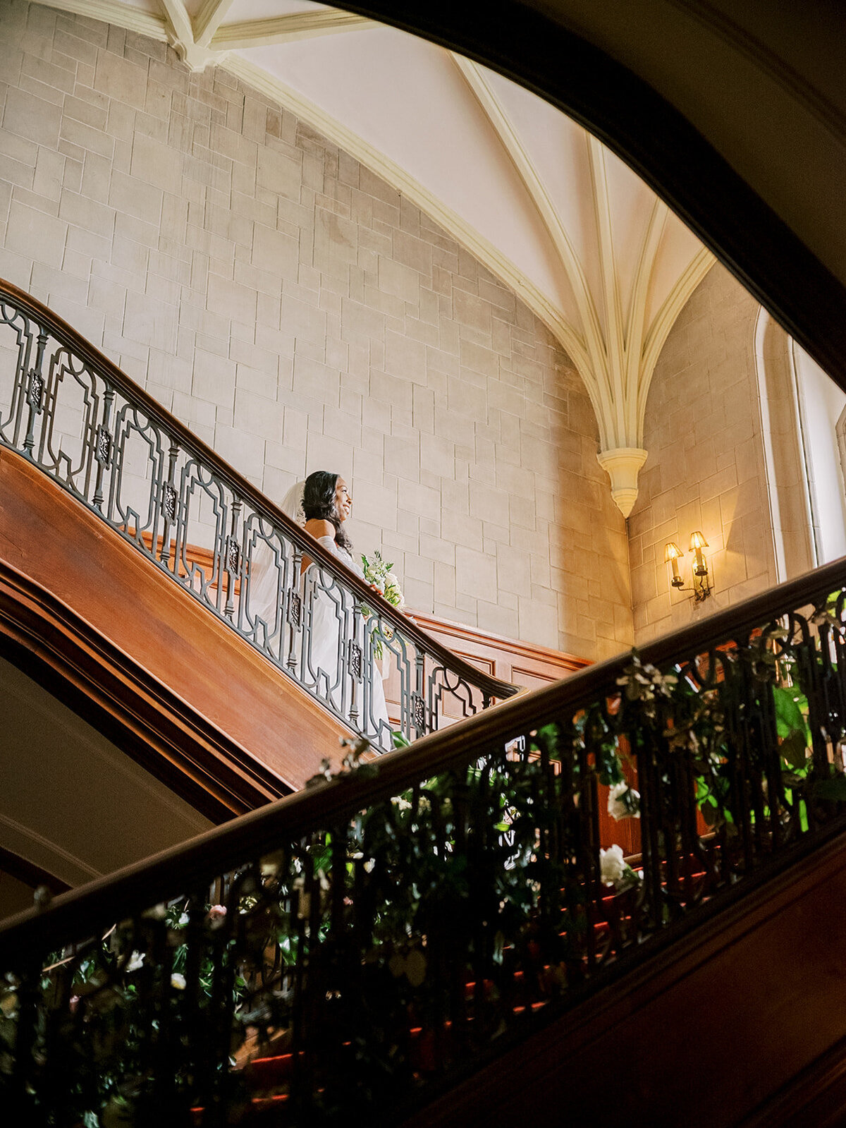 black-bride-walking-down-the-callanwolde-staircase-elizabeth-austin-photography