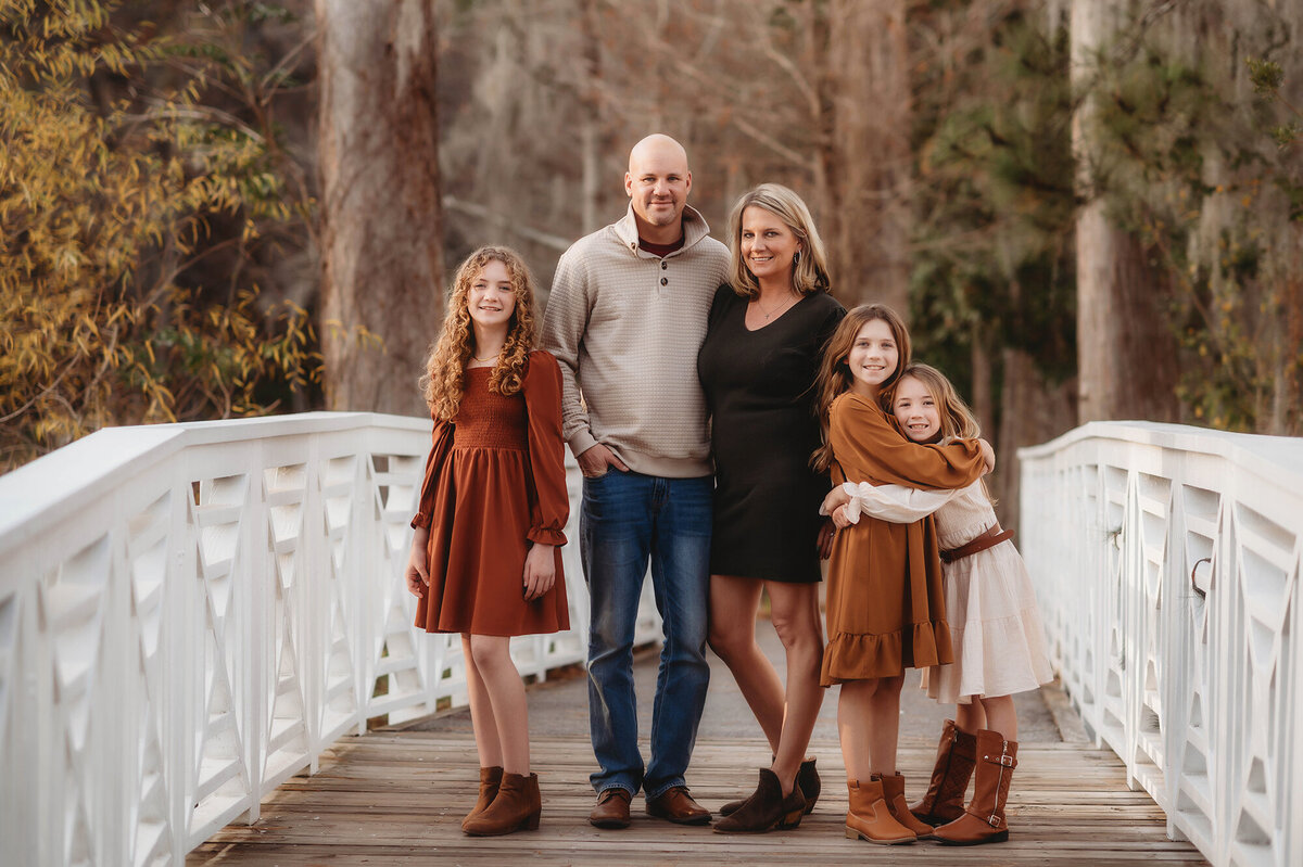Family poses together during their Family Photoshoot at Cypress Gardens near Charleston, South Carolina.
