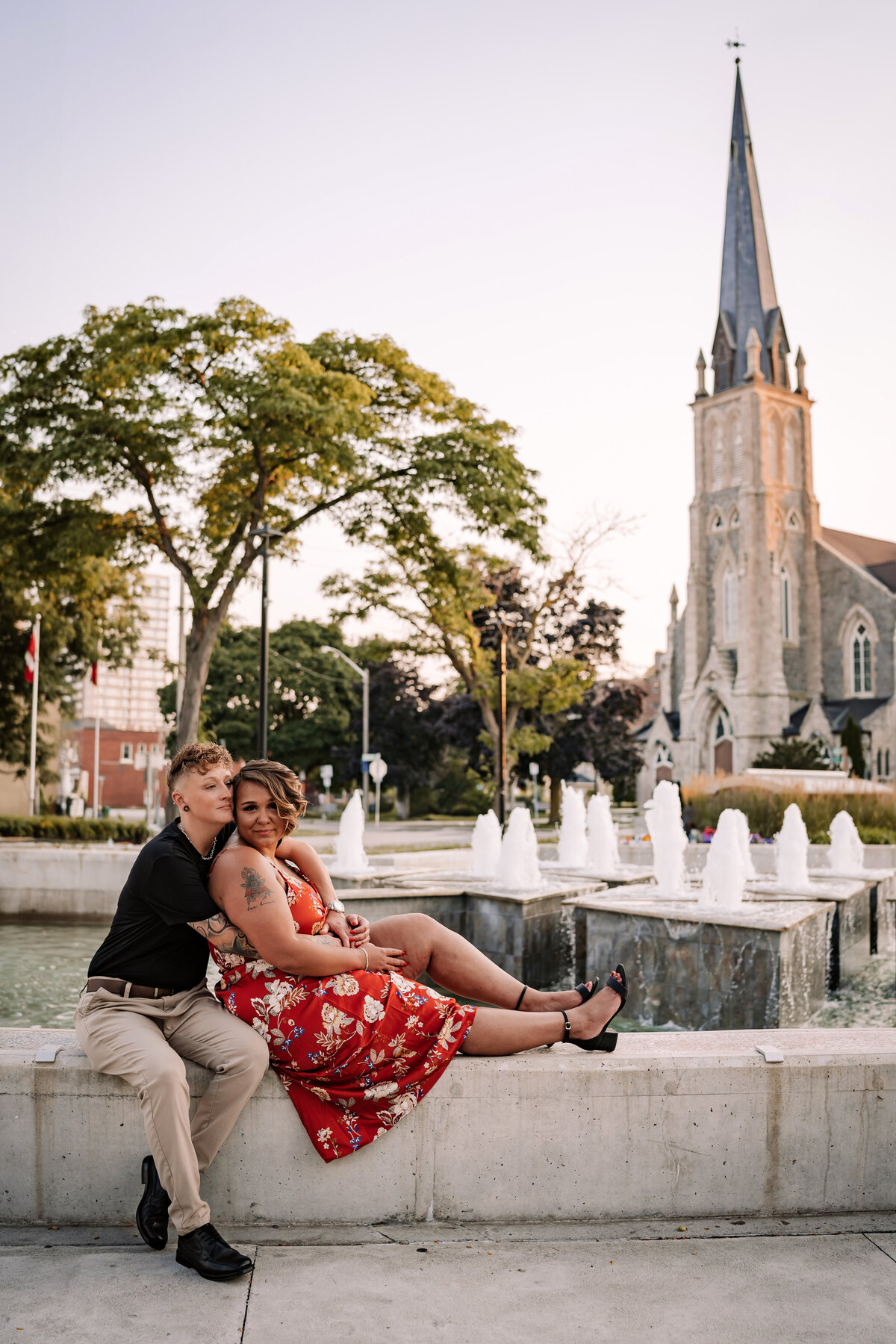 Couple sitting on a fountain