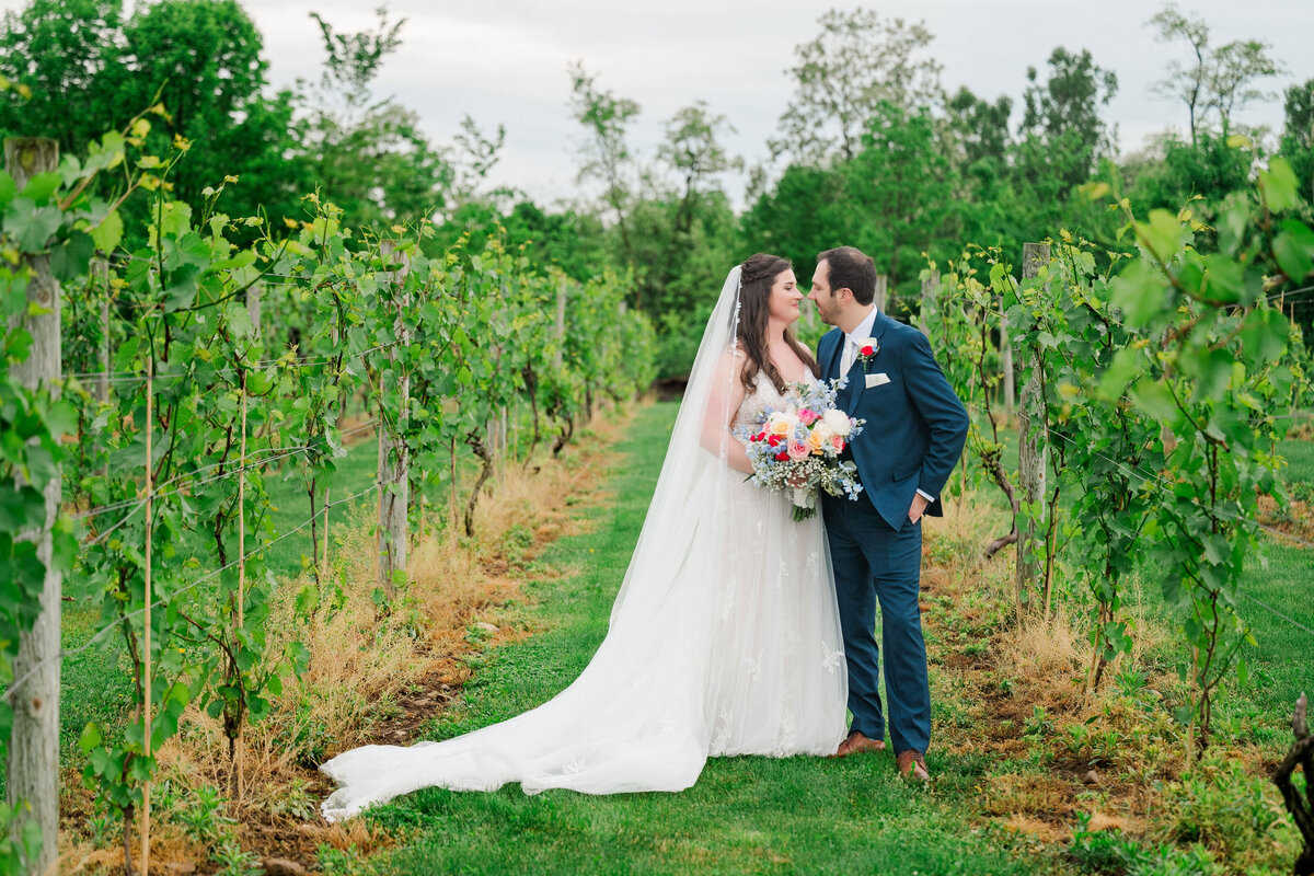 married couple wedding photo in the vineyards at pine lake