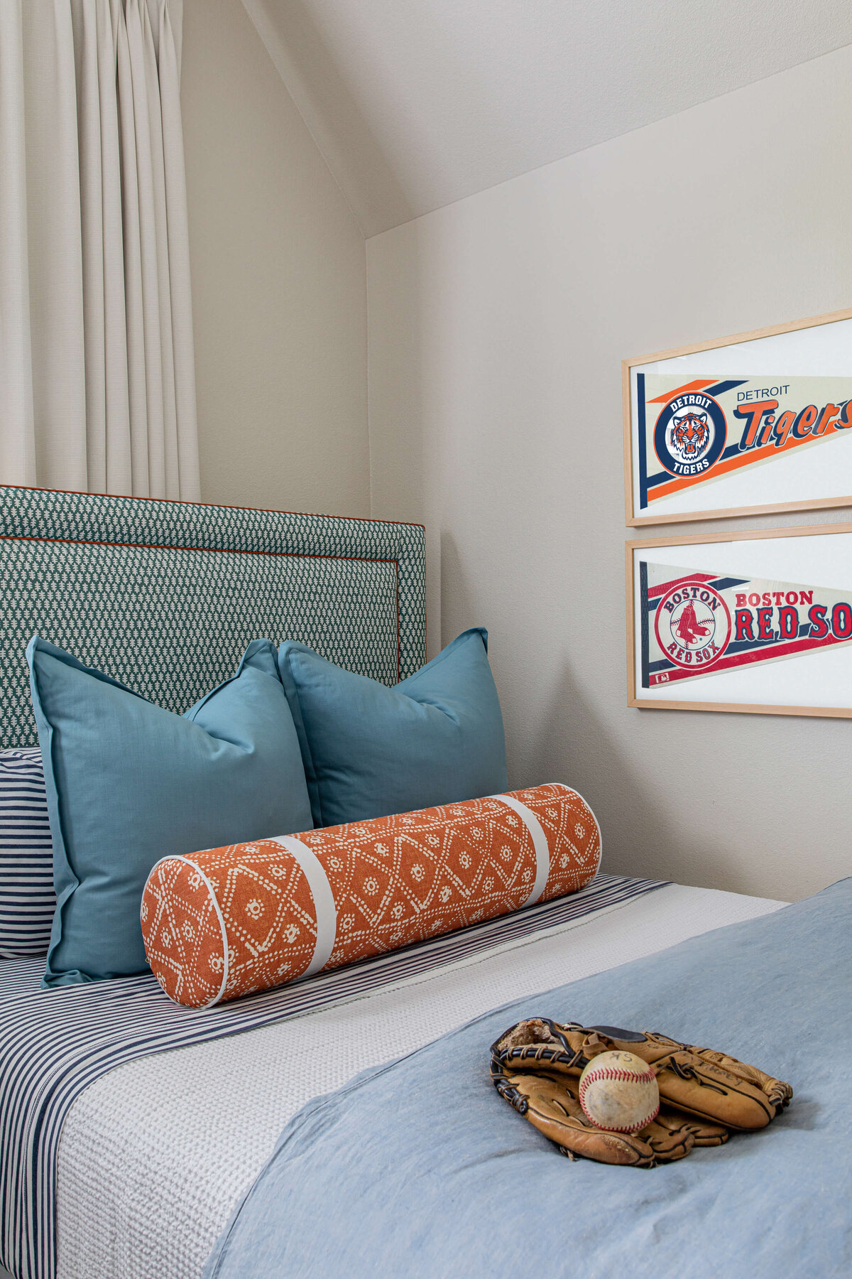 oyster creek studios aryns home blue and red pillows and baseball decor in bedroom