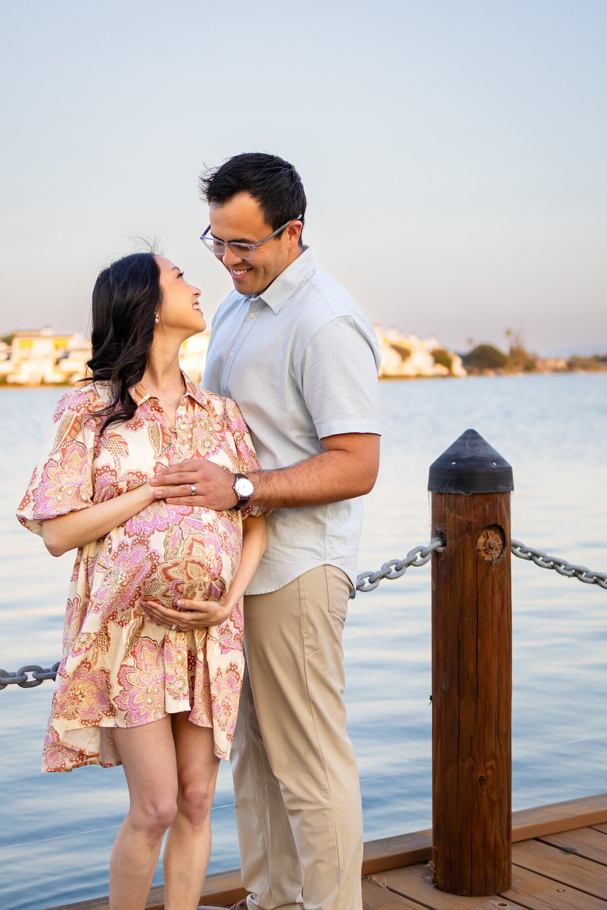Pregnant couple gazing at each other joyfully by the water — Bay Area Maternity Portfolio - Ellobelle Photography