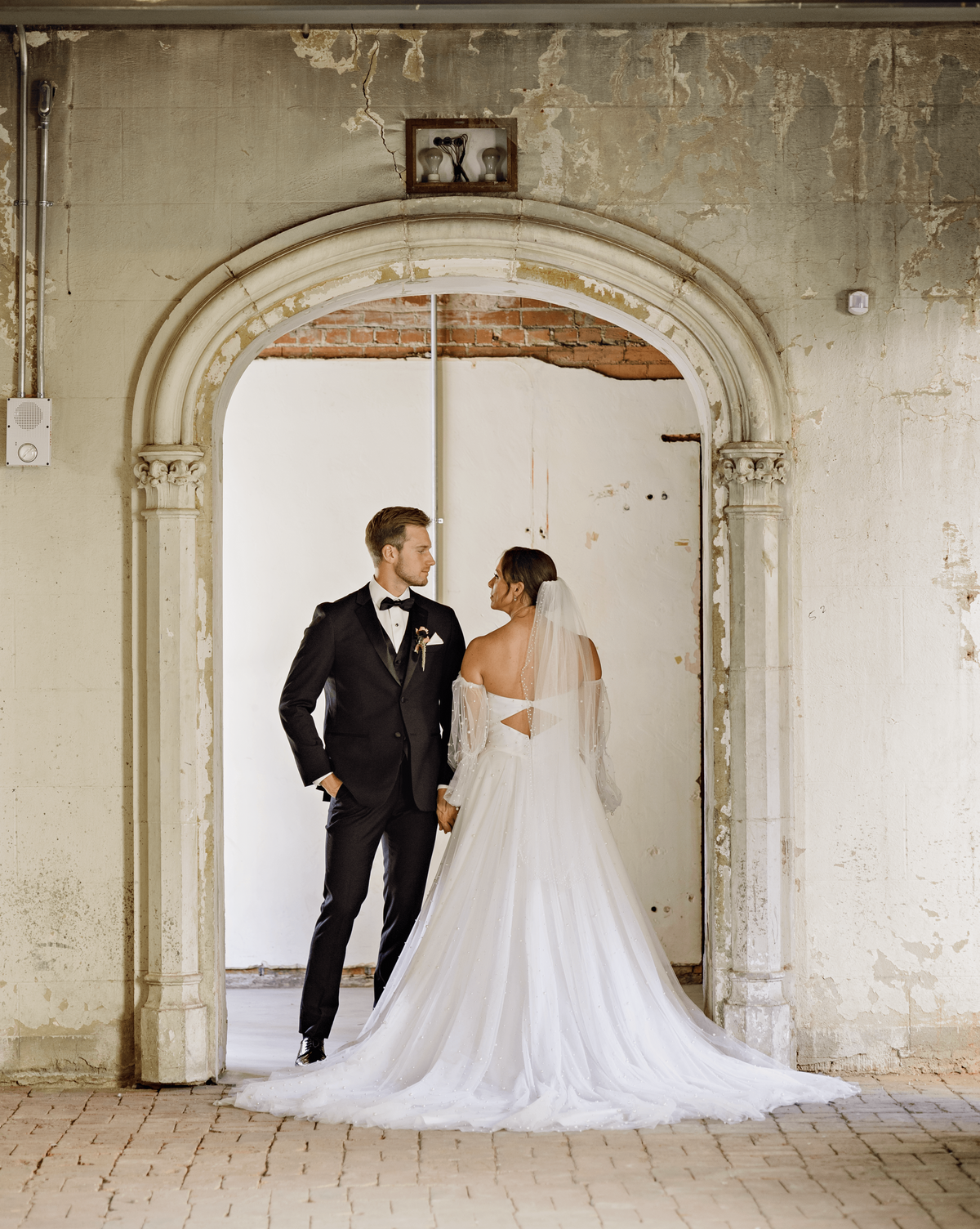 bride and groom at doorway photo