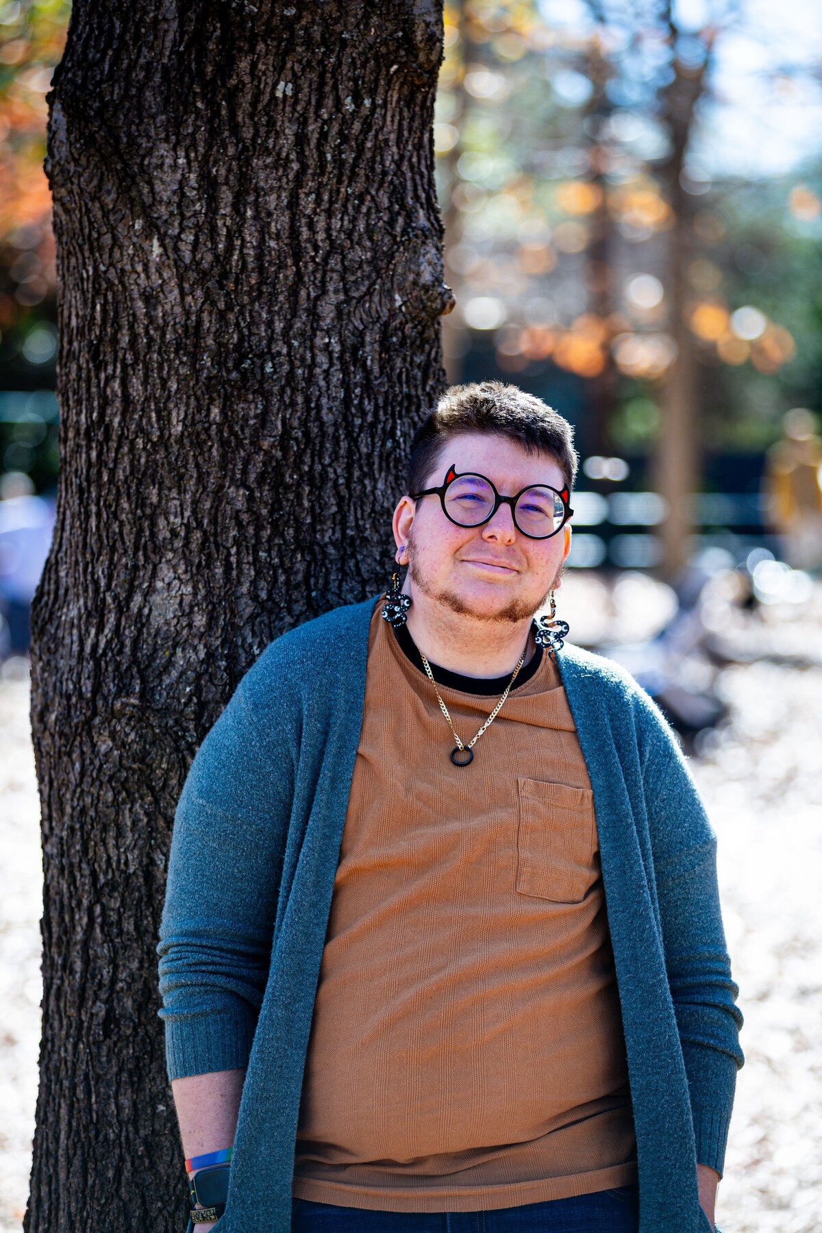 A person leaning back against a tree.