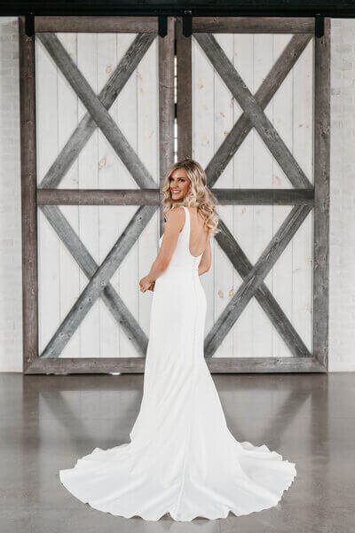 Bride in front of venue planned by luxury wedding planner chicago
