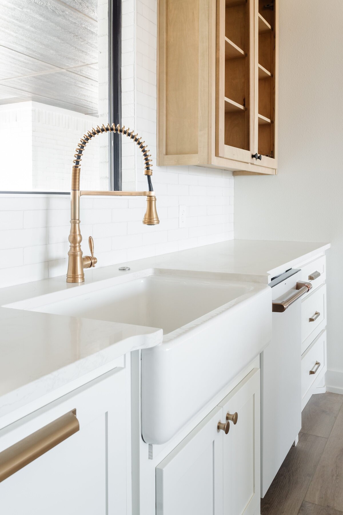 Marcie Meredith Texas based interior design photography. White kitchen gold faucet Victory Homes