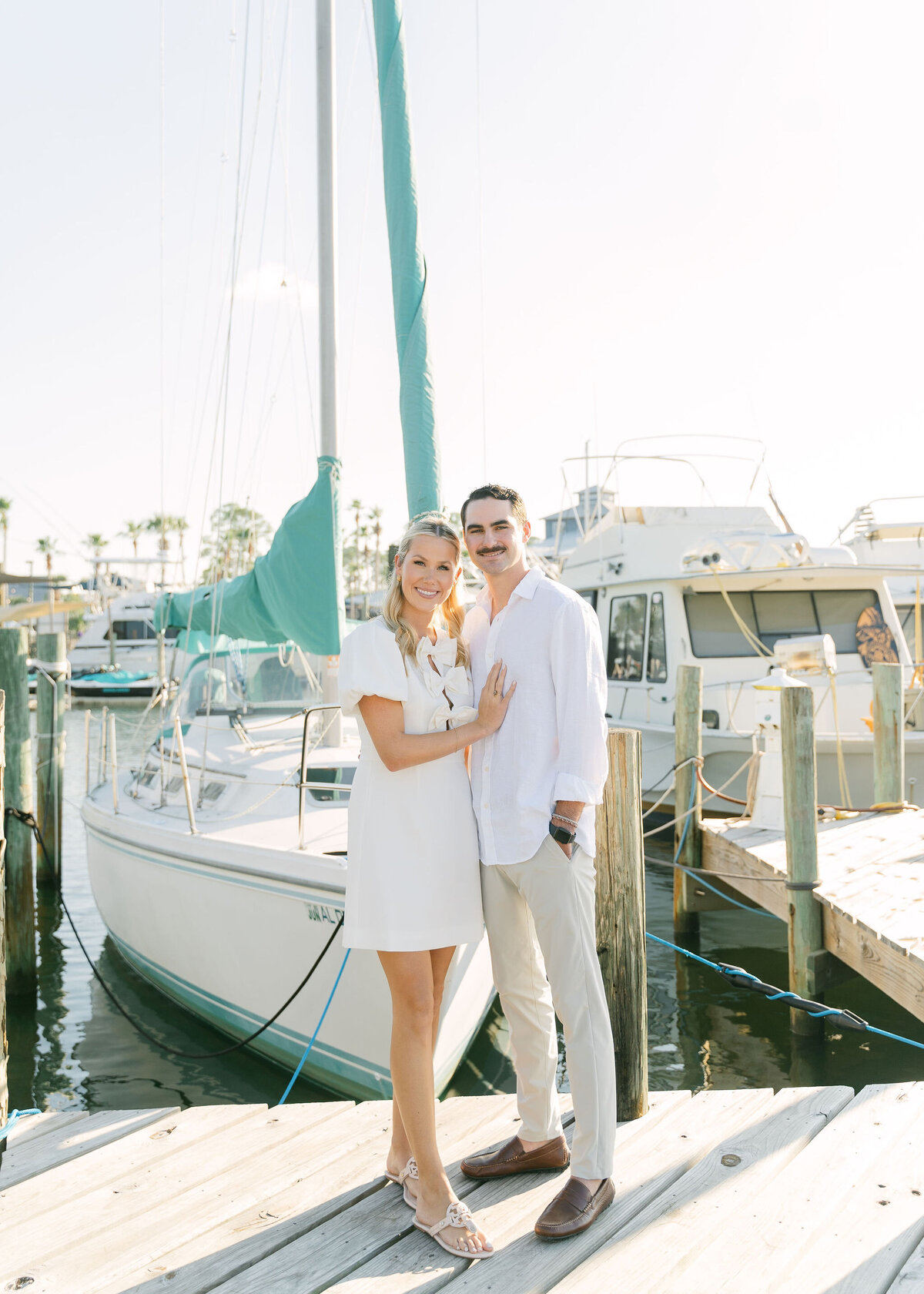 couple standing together on a boat dock