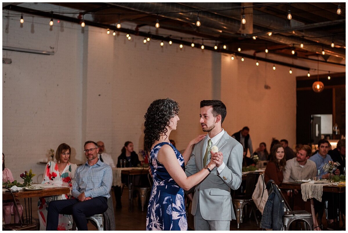 A groom and his mother dance at Skylight during the mother son dance