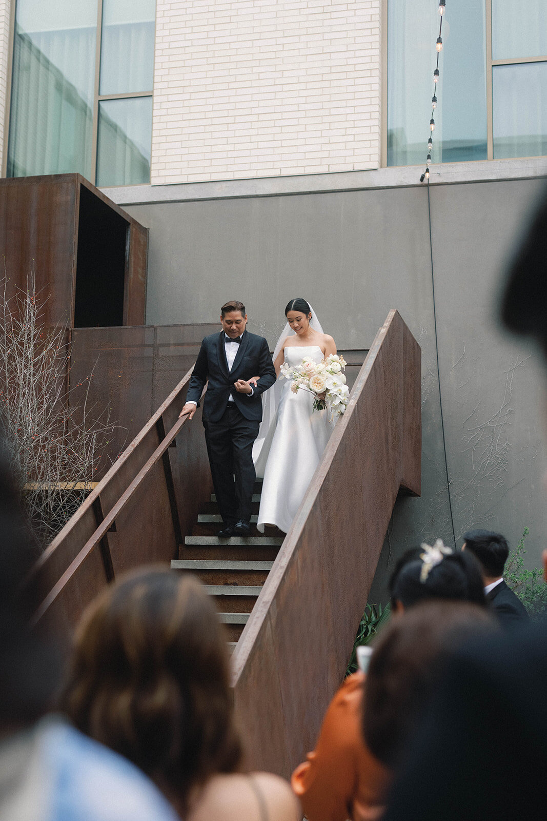 bride-walking-downstairs-south-congress-wedding-ceremony