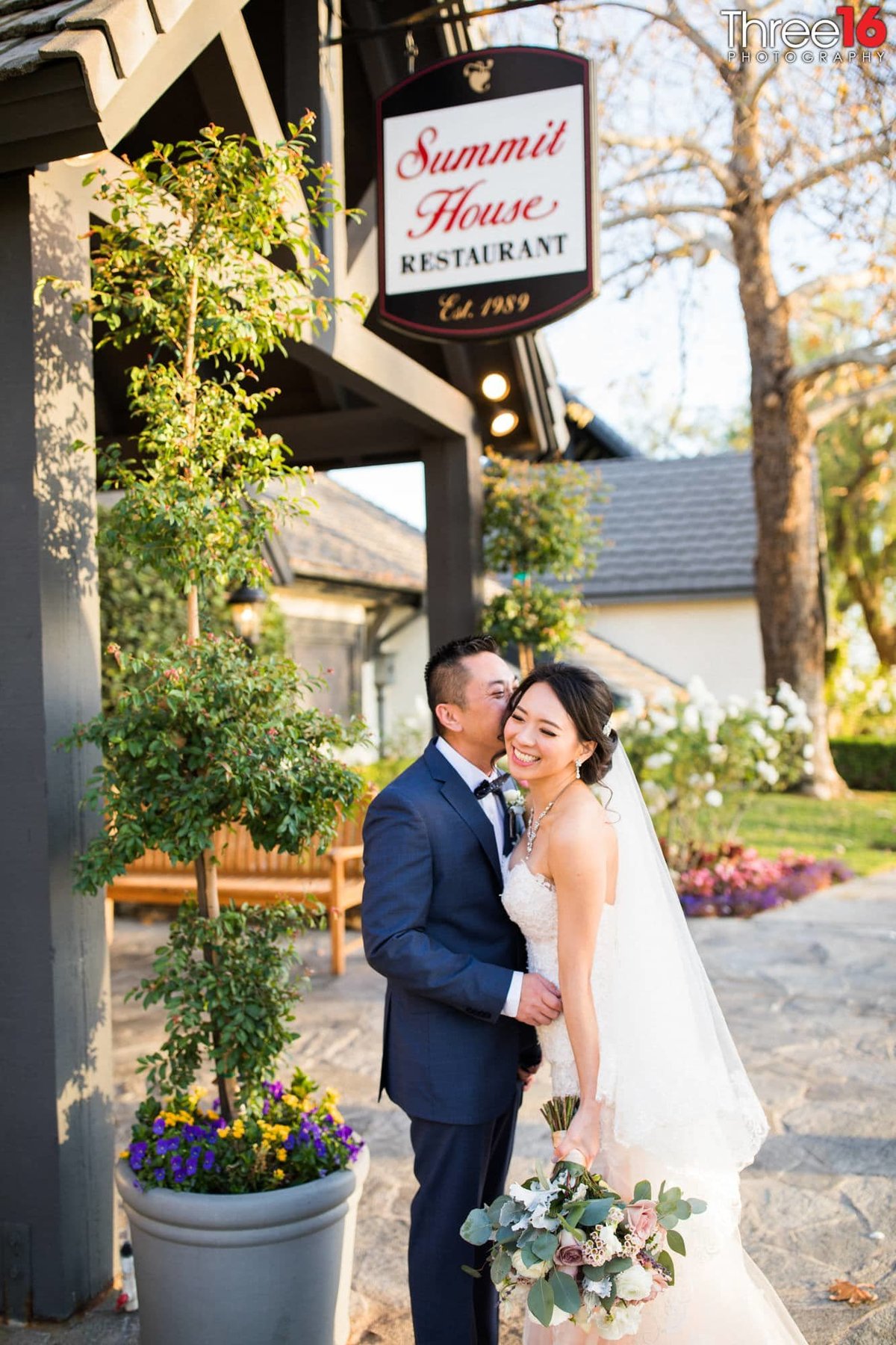 Groom whispers into his Bride's ear