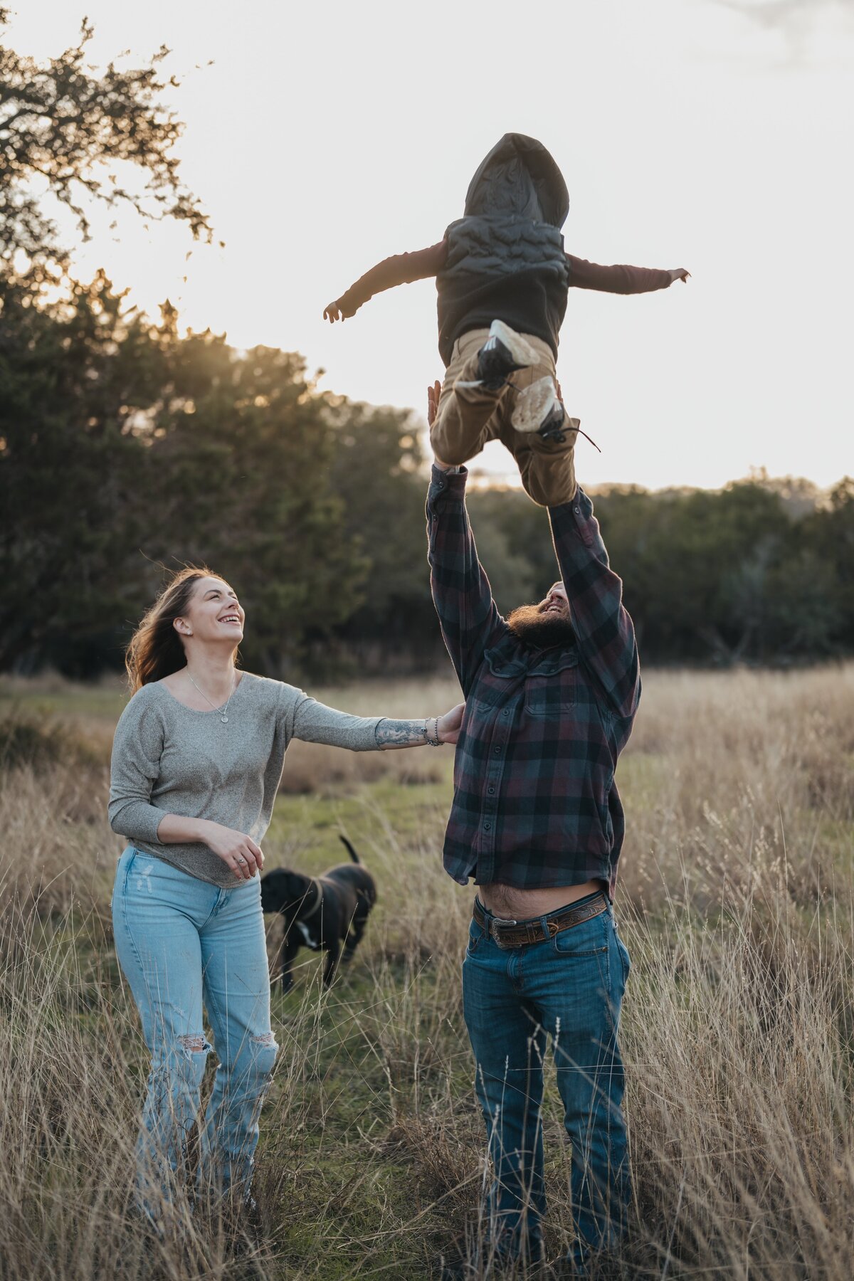 dad-throwing-son-in-air