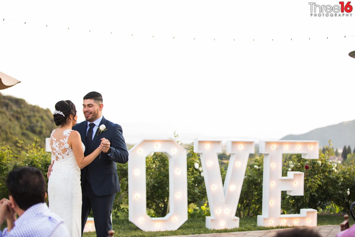 Bride and Groom share their first dance