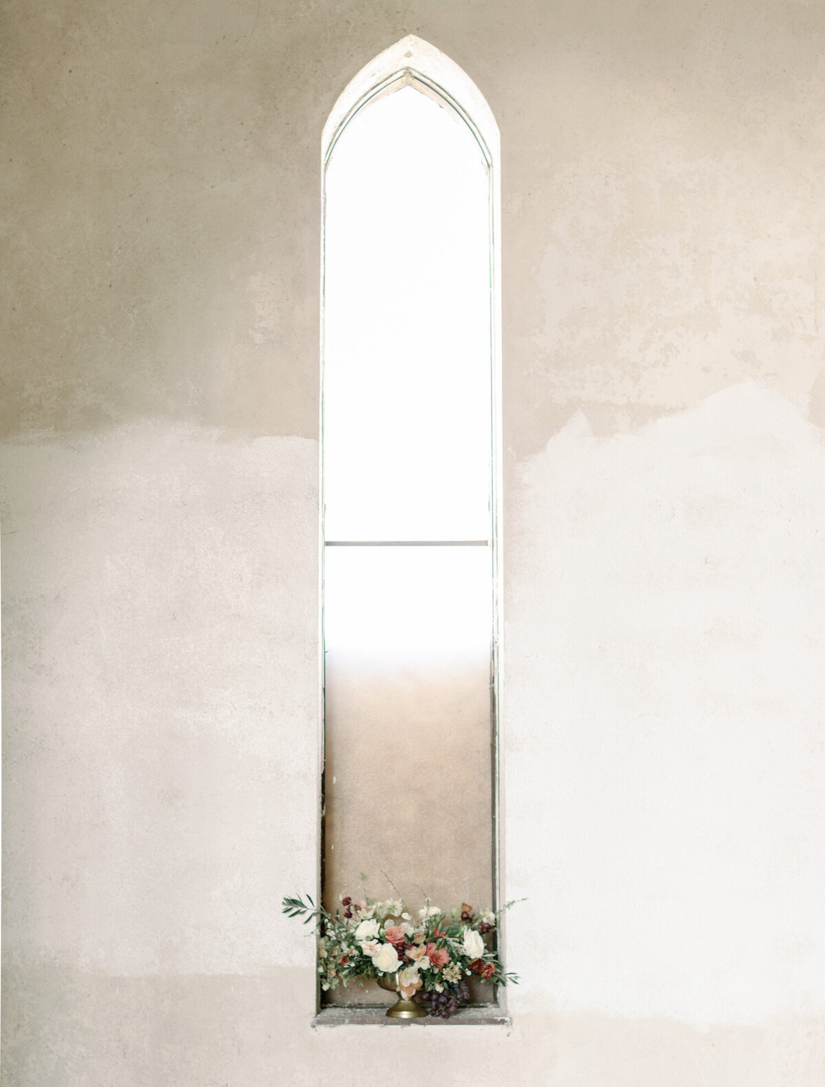 wedding flowers in arched window, Greece ruins wedding venue