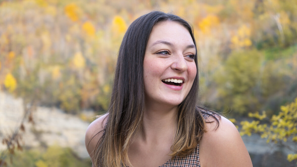 Close up headshot of a smiling college student