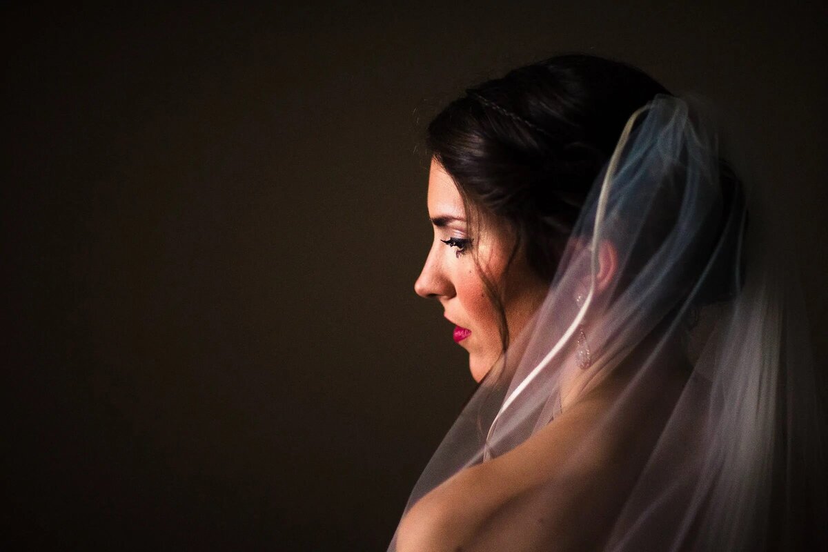 The back of a bride as she looks over her shoulder