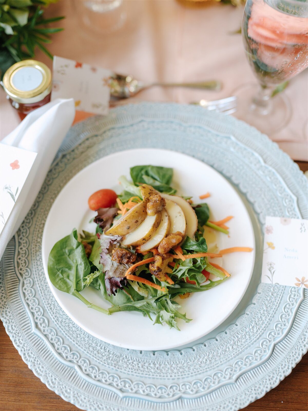 Glazed Pears on a Bed of Field Greens with Carrots Grape Tomatoes Spiced Nuts and Apple Cider Vinaigrette