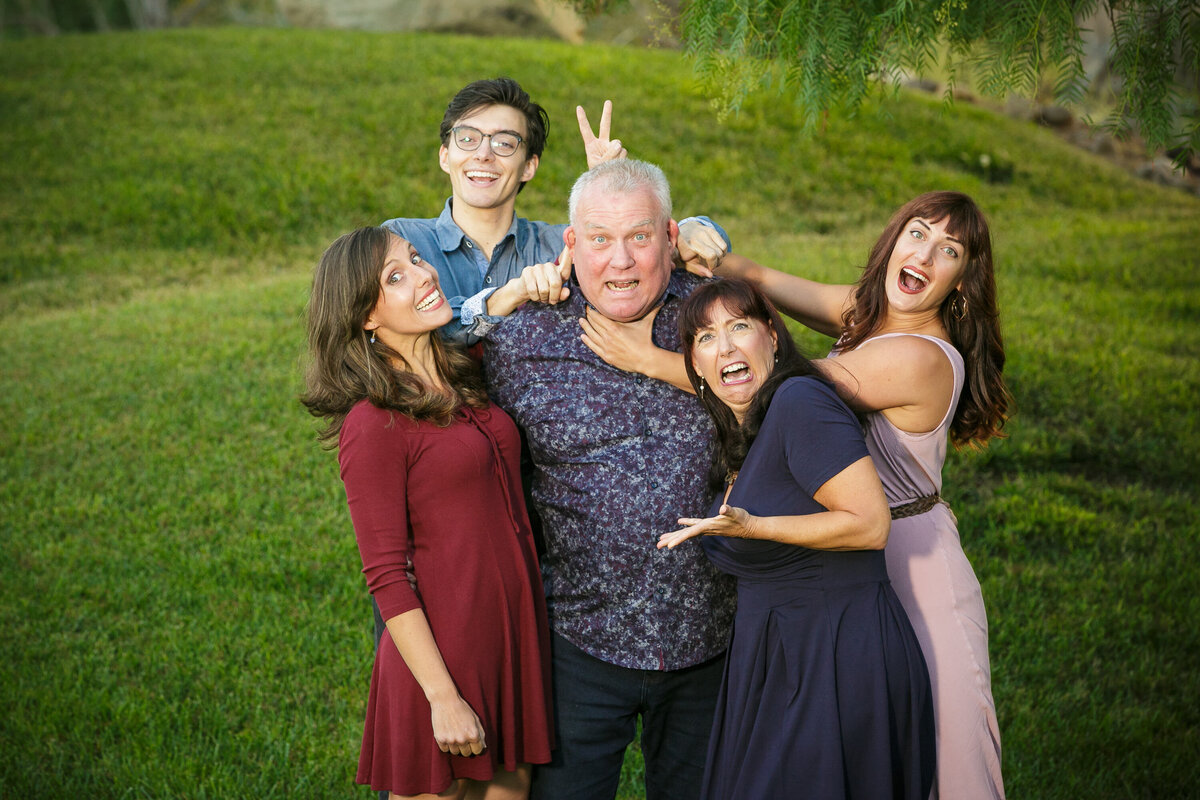 A family making funny faces and smiling