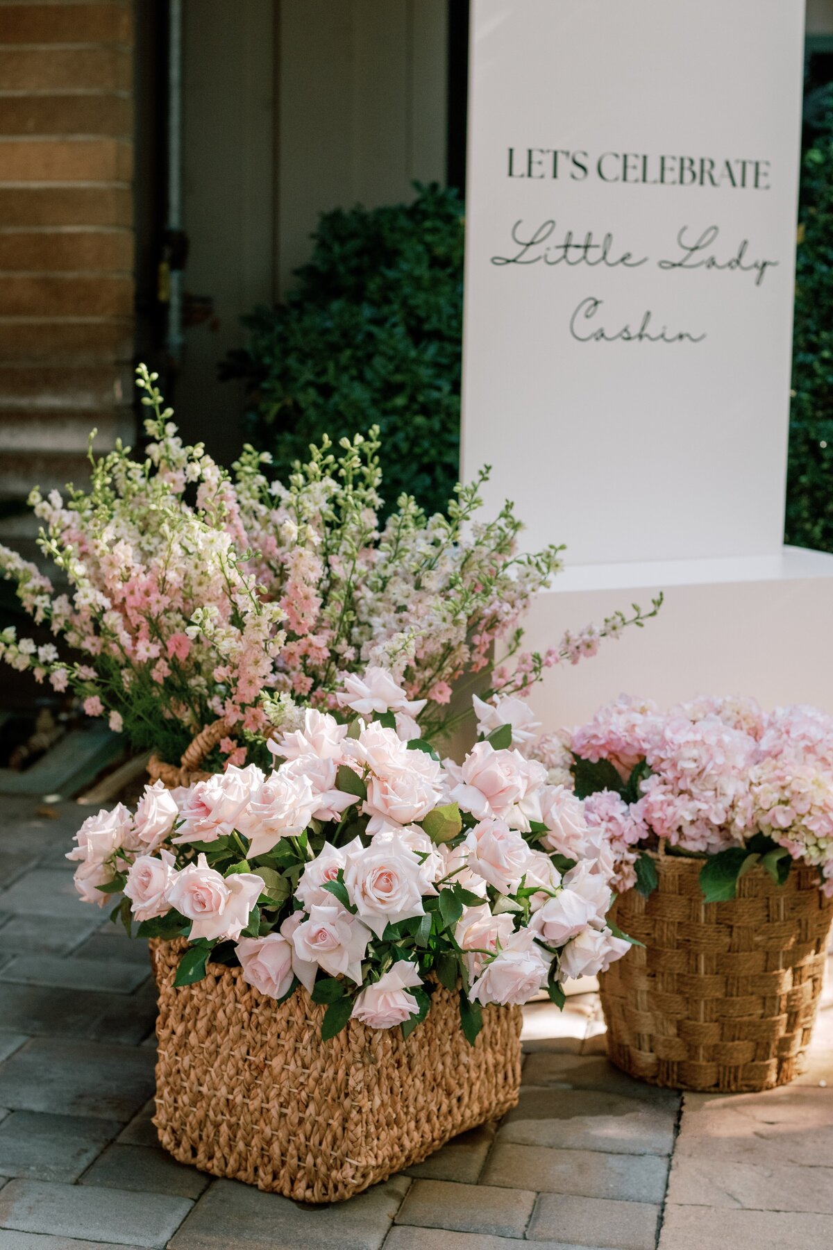 Welcome sign, flower baskets,