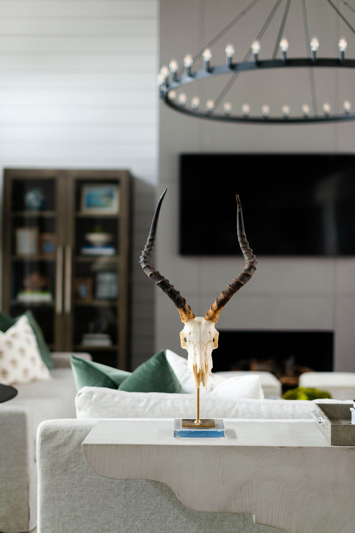 oyster creek studios building belt new build skull sculpture on side table in living room