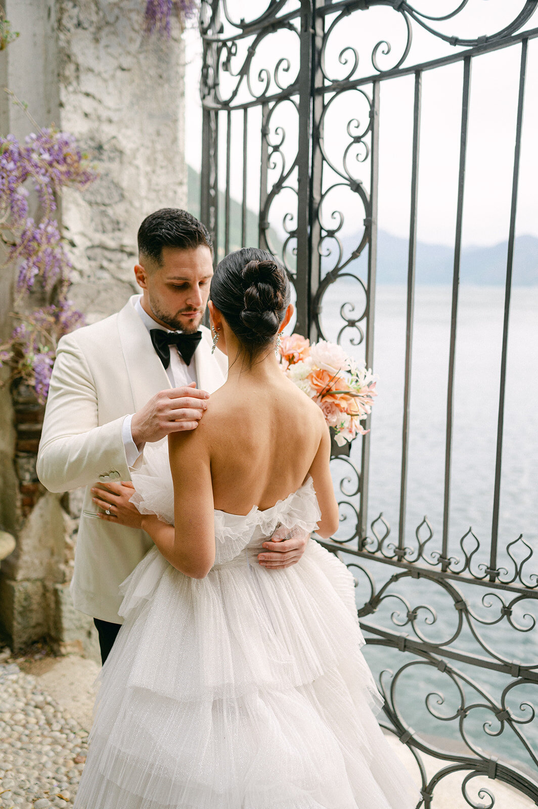 Bride and Groom embrace near Lake Como, Italy on their wedding day.