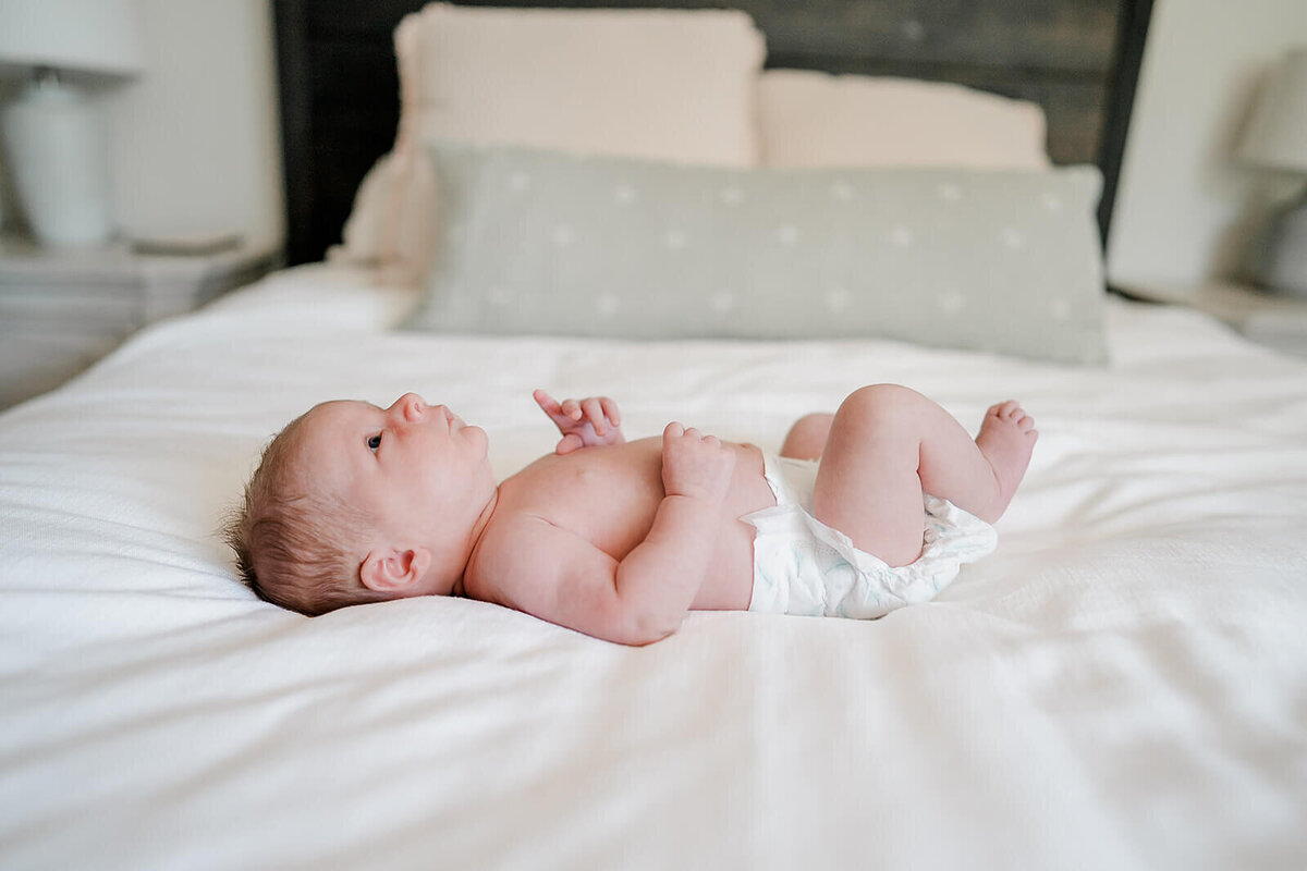 Natural newborn portraits in San Ramon home using soft, neutral tones.
