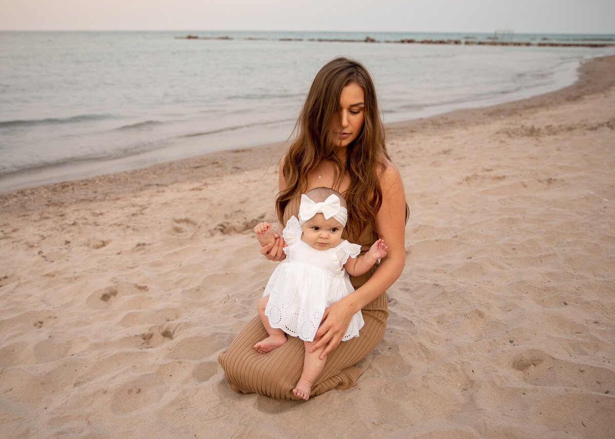 Mother Holding Newborn at Beach Milwaukee