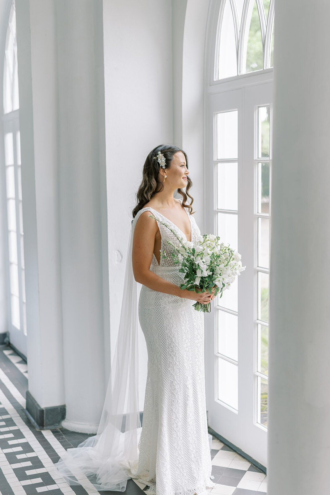 bride holding white floral bouquet at Lowndes Grove wedding