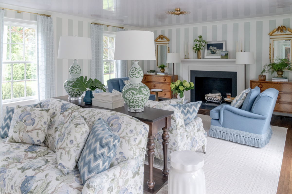 Living Room interior design with traditional details, blue-toned accents and blue and white striped wallpaper