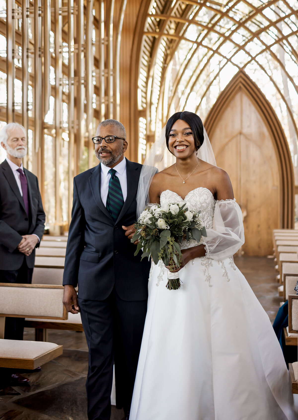 a bride walks down the isle