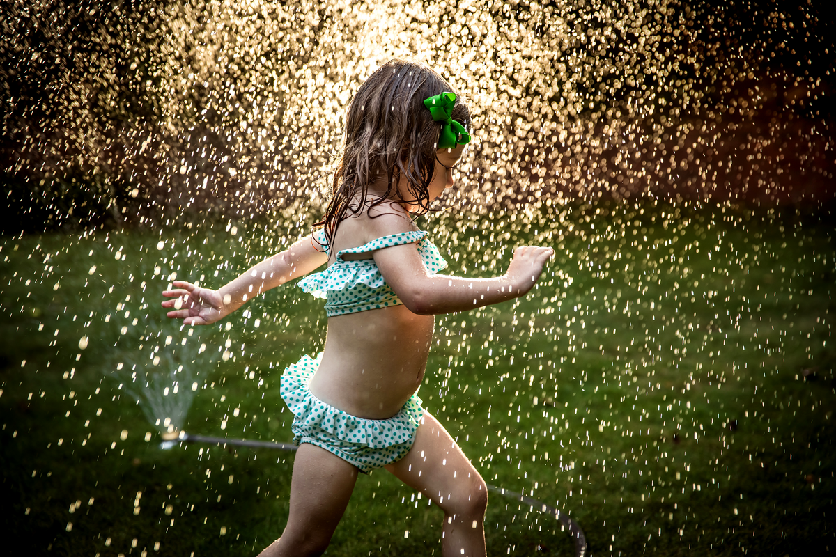 family photographer, columbus, ga, atlanta, documentary, photojournalism, sprinkler, sun, water drops, little girl running, ker-fox photography_8502