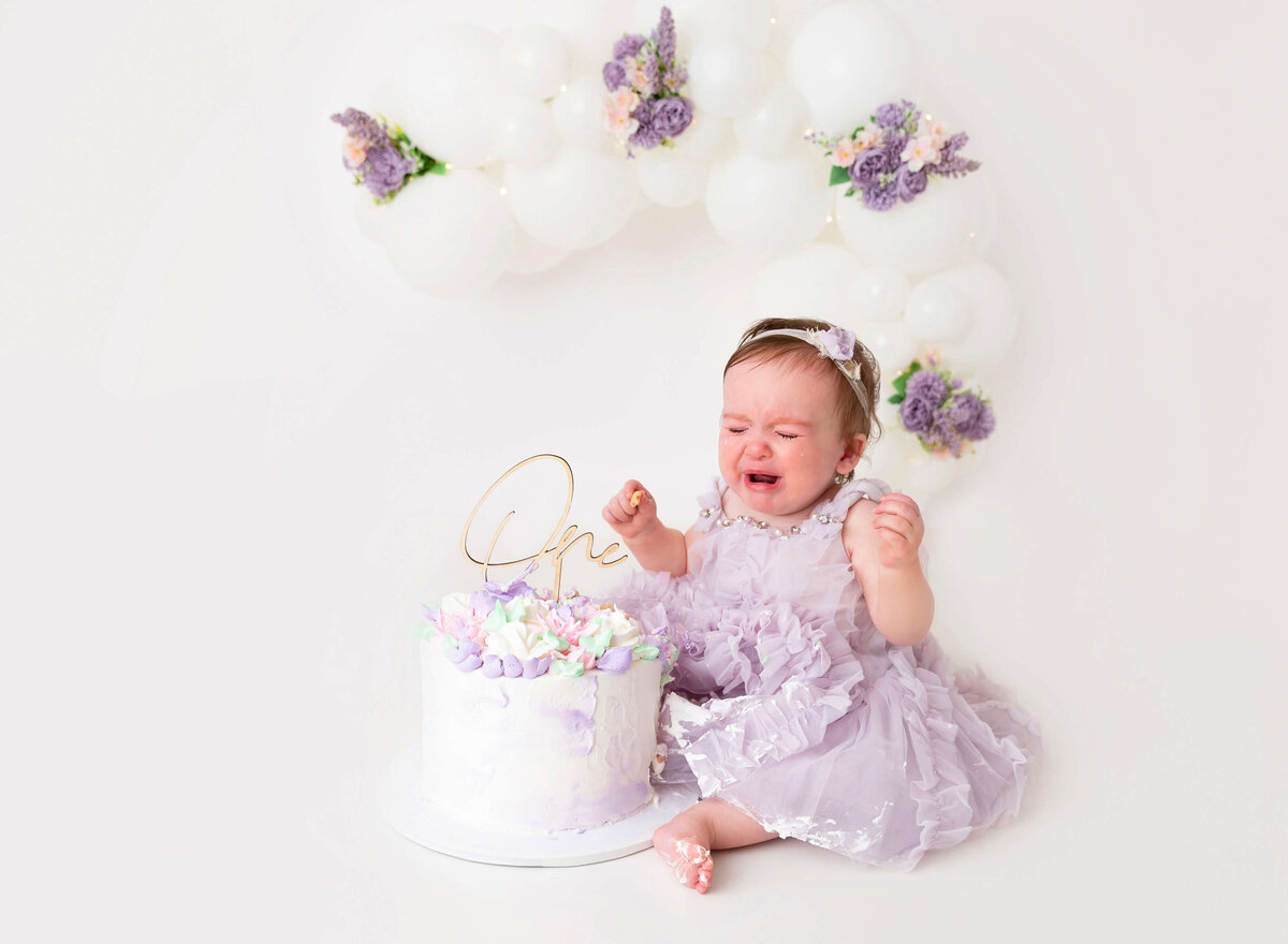 Lavender cake smash session for baby girl By Brooklyn cake smash photographer 