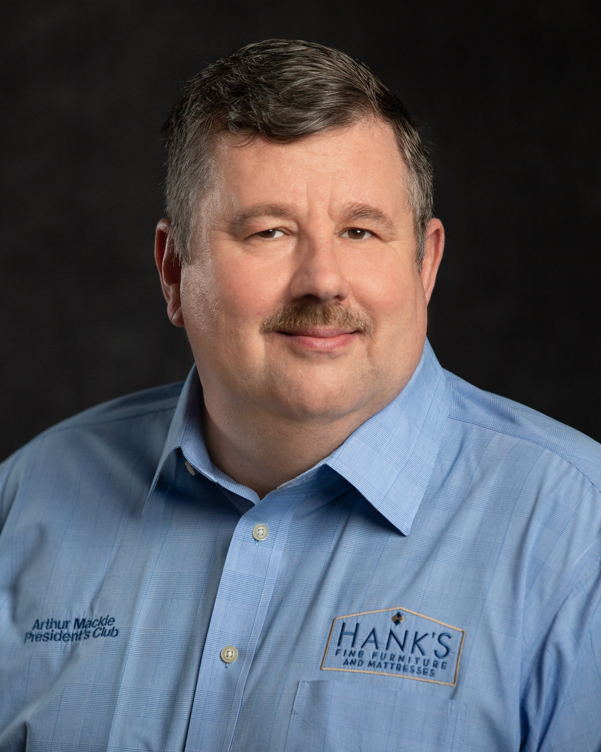 Arthur Mackie's head shot for salesman of the year award at Hanks Fine Furniture.