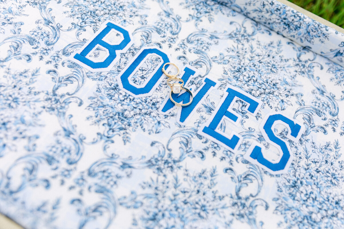 wedding-rings-blue-toile-bowes-details-flatlay