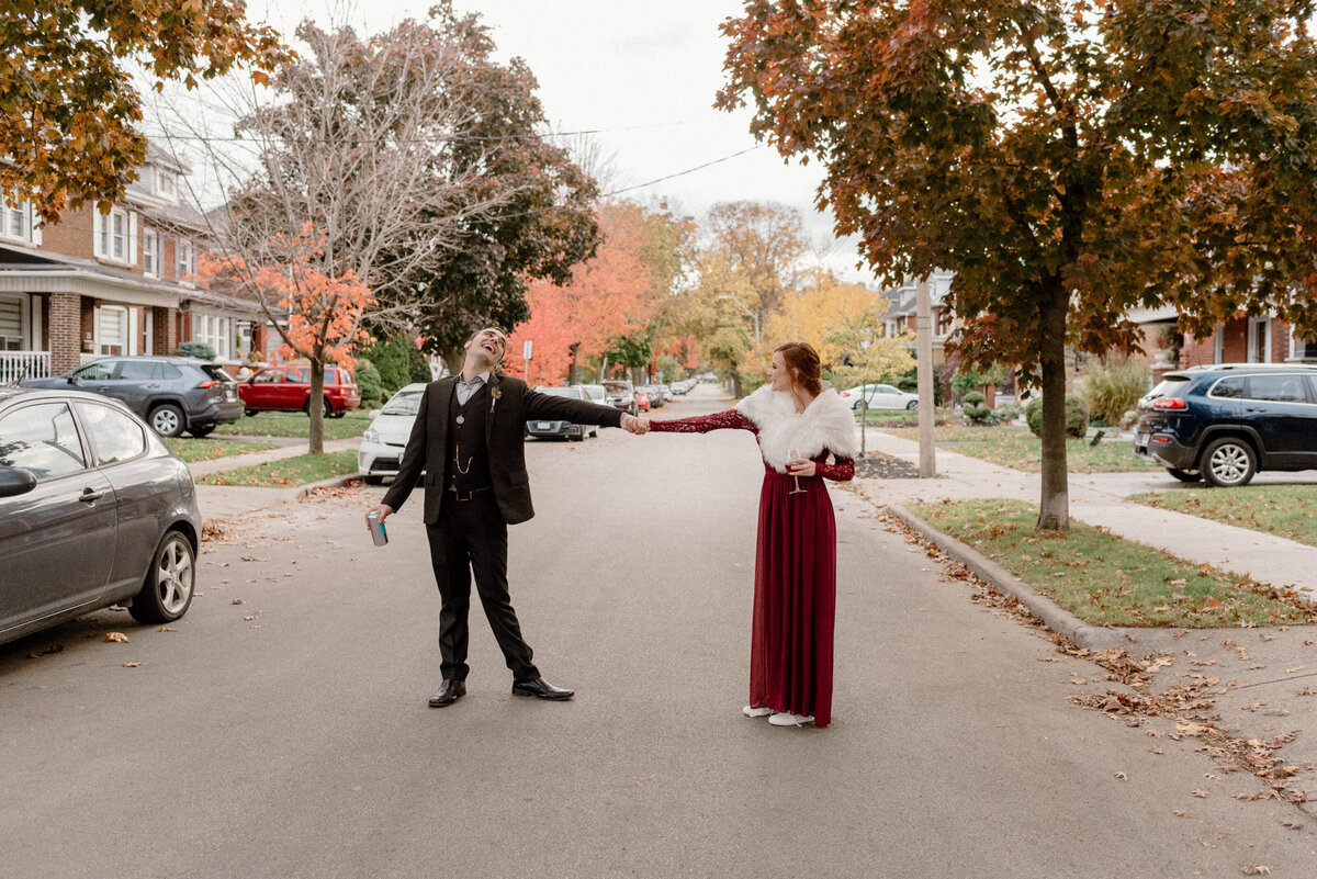 bride and groom dance in the street after their ceremony