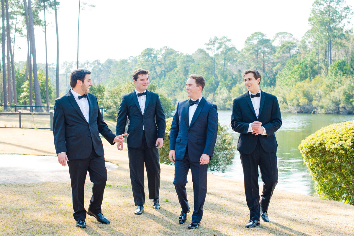 Groomsmen hanging out before a Veuve-inspired wedding at Palmetto Bluff in Charleston, SC. Photographed by Charleston Wedding Photographer Dana Cubbage.