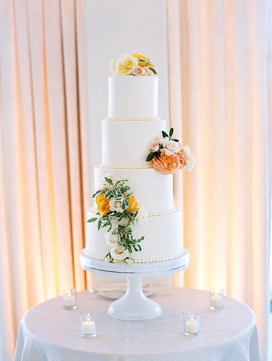 Four Tier White Wedding Cake with Buttercream and Peach Flowers © Bonnie Sen Photography
