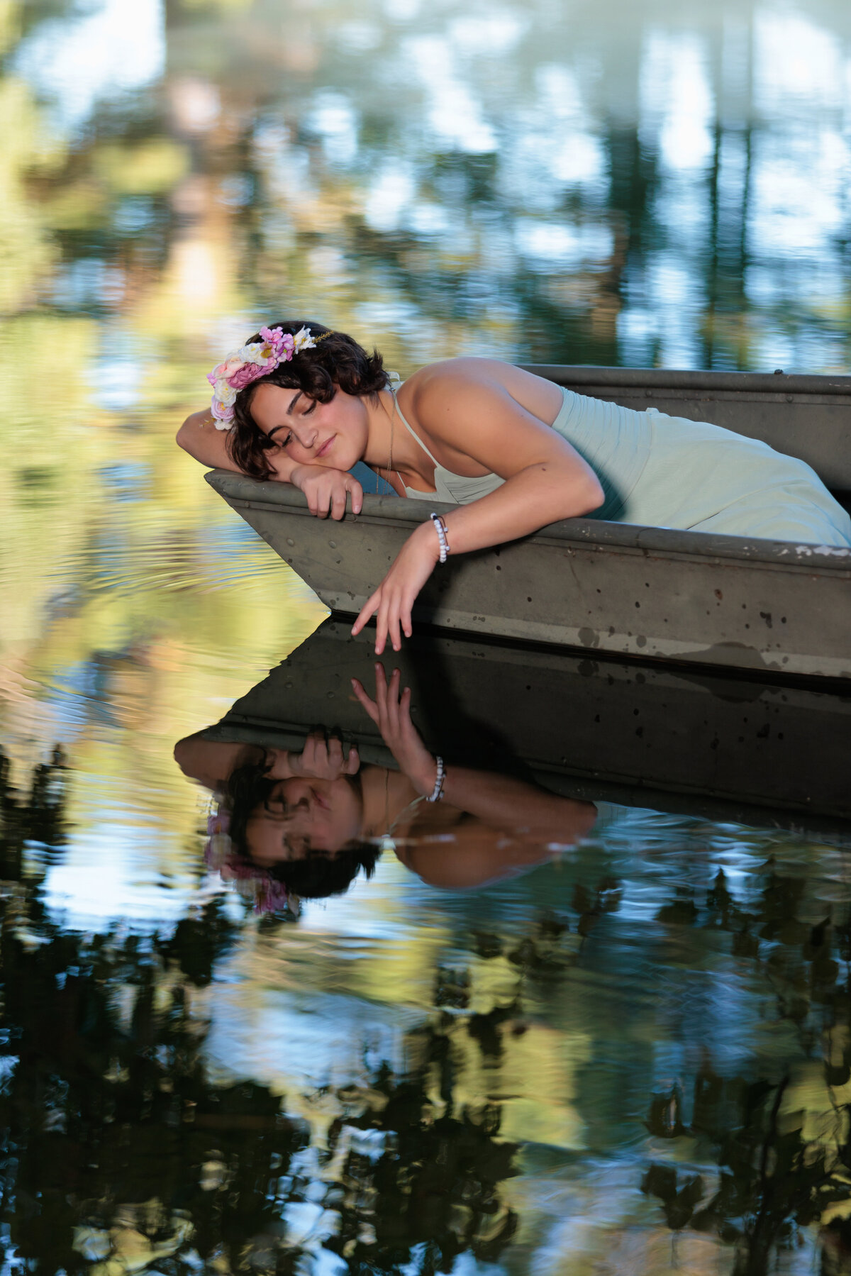Holly Springs Senior in a boat with reflection in the pond