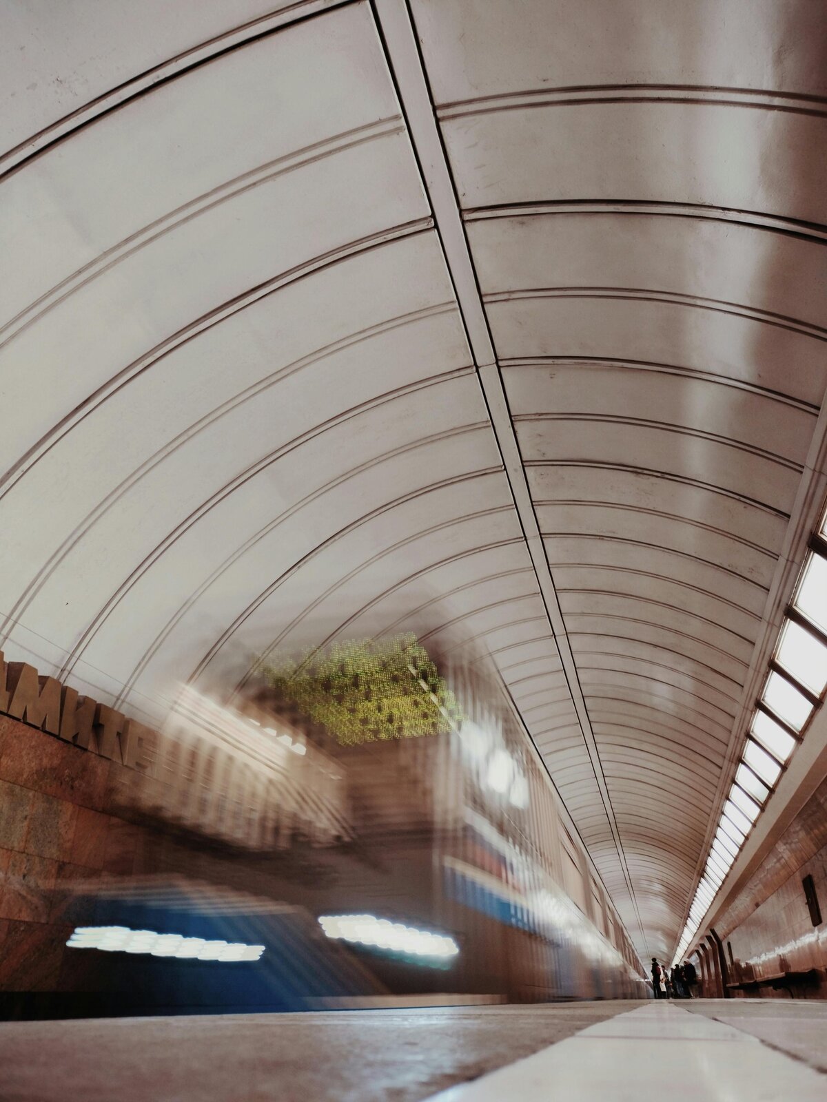 Motion-blurred subway rushing through a tunnel, symbolizing diagnosing hidden organizational patterns and fast-moving issues.