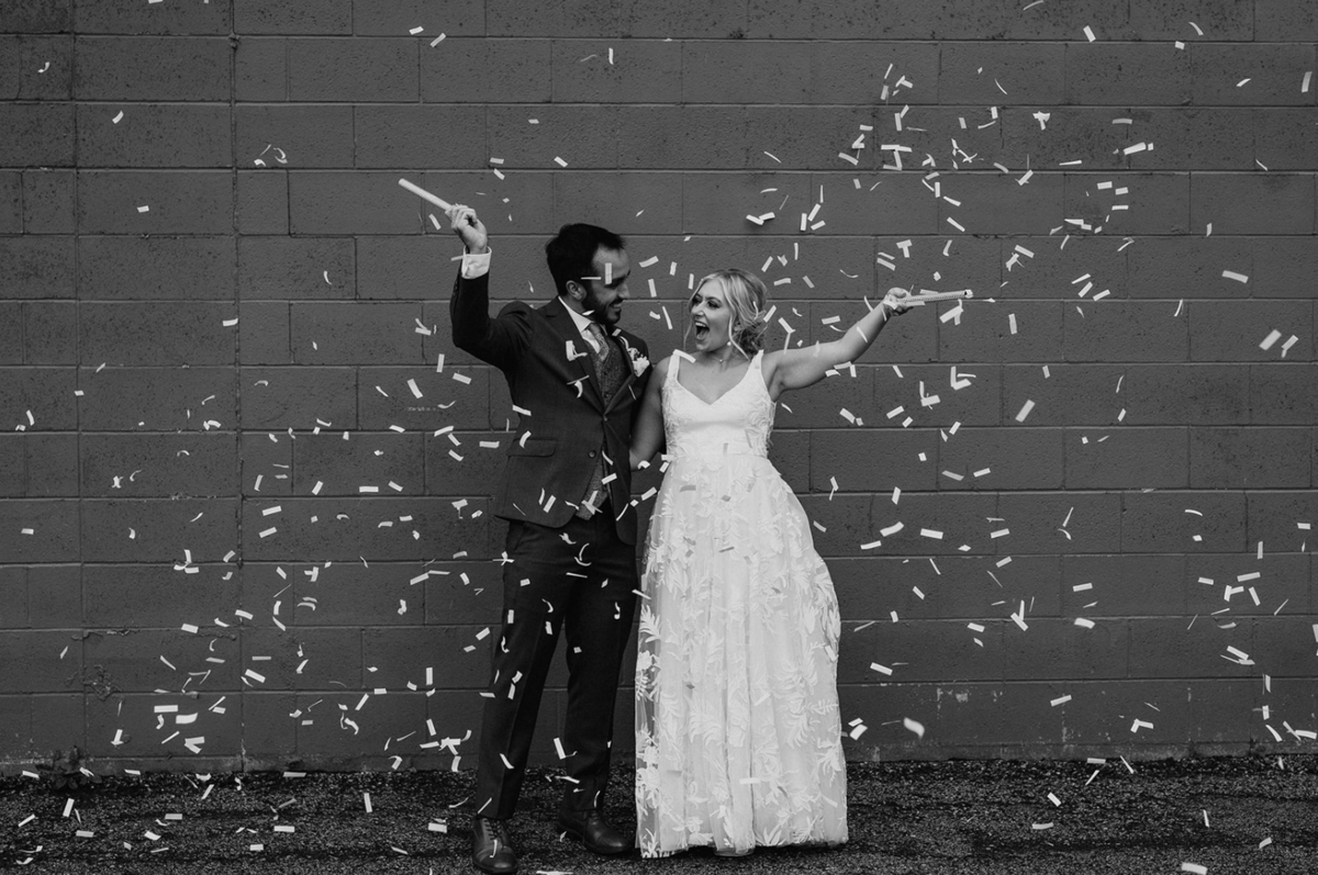 A bride and groom strolling together during golden hour wedding portraits