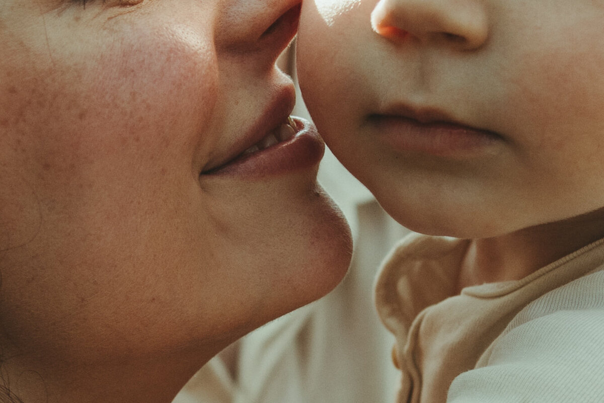 Close up shot of a mom kissig her baby's cheek, Intimate Wedding, Elopement, and Family Photography NYC and Western North Carolina Area