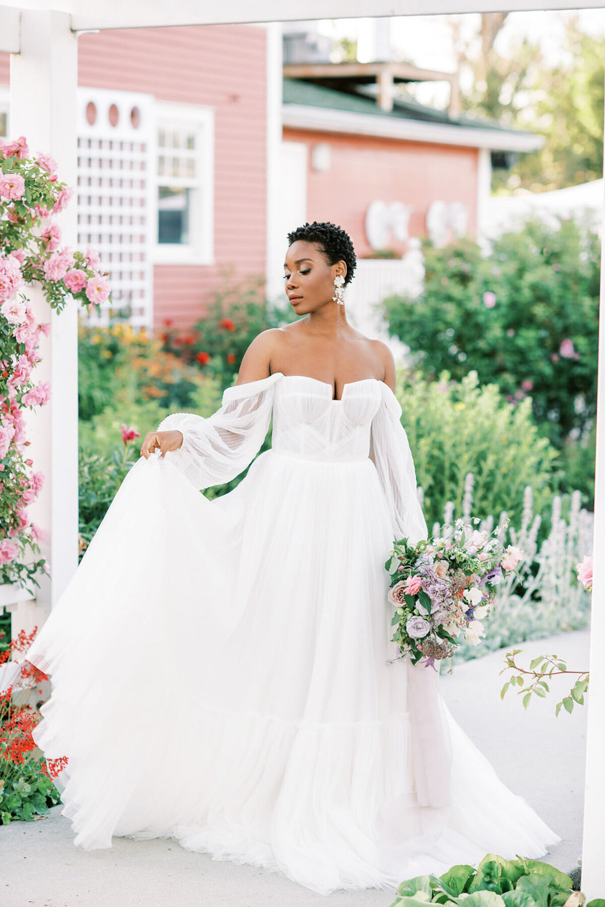 Stunning and whimsical bride wearing gown from Blush & Raven, a couture wedding bridal boutique based in Calgary, Alberta. Featured on the Brontë Bride Vendor Guide.