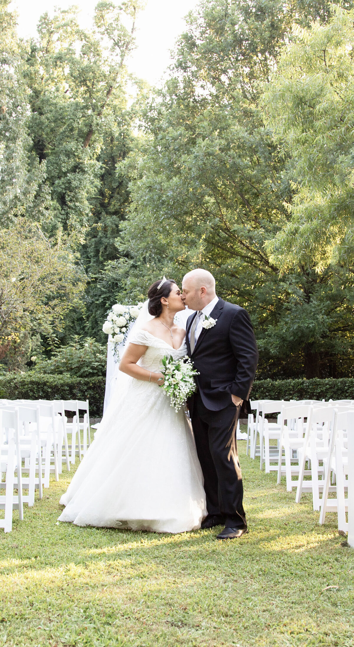first-kiss-bride-groom-quiet-luxury-atlanta-wedding copy
