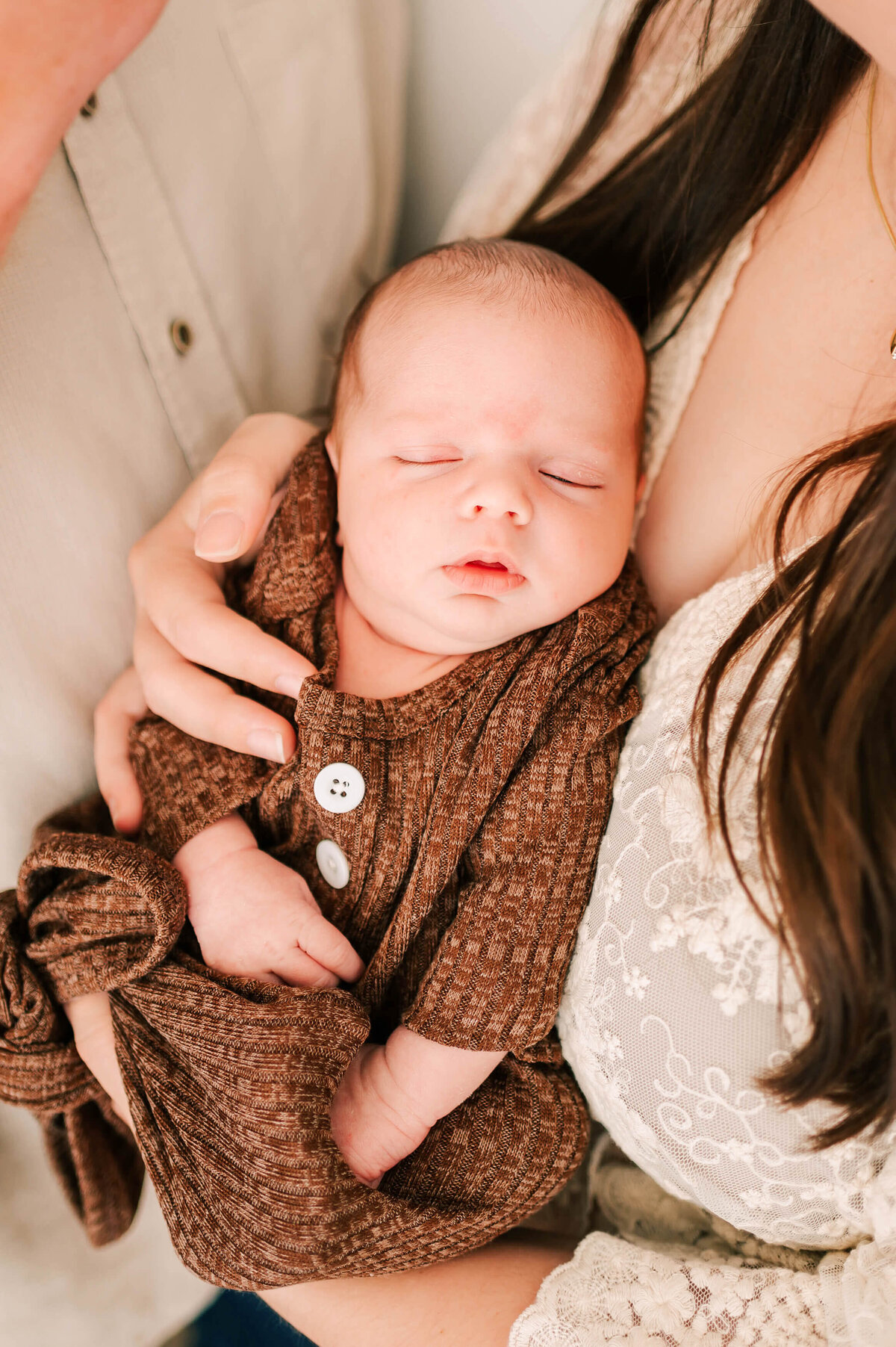 newborn picture in Springfield MO of baby boy sleeping in brown outfit