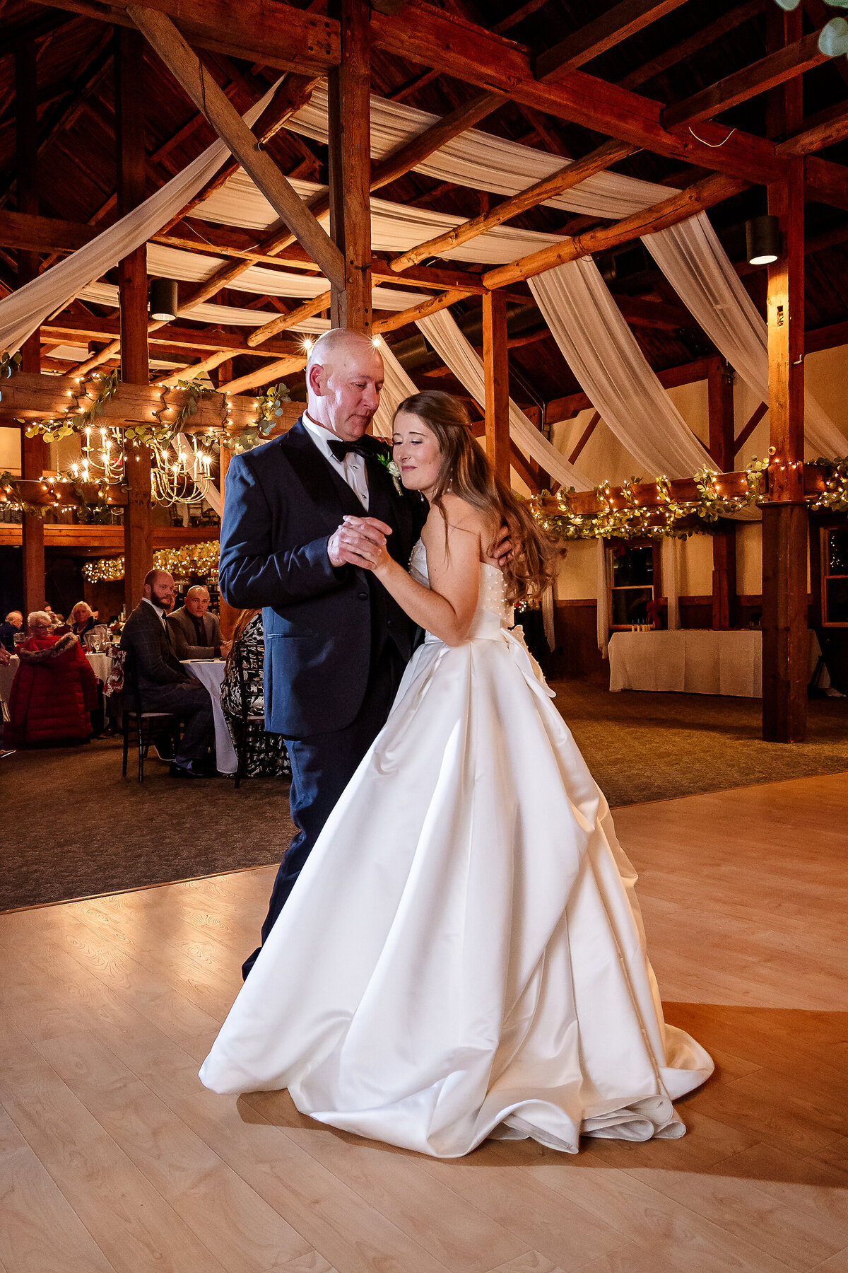 Father and bride dance at The Inn on Main in lakes region wedding