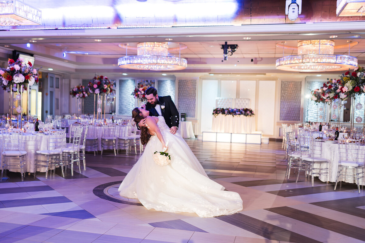 Wedding couple enjoying a private dance during their reception room reveal.