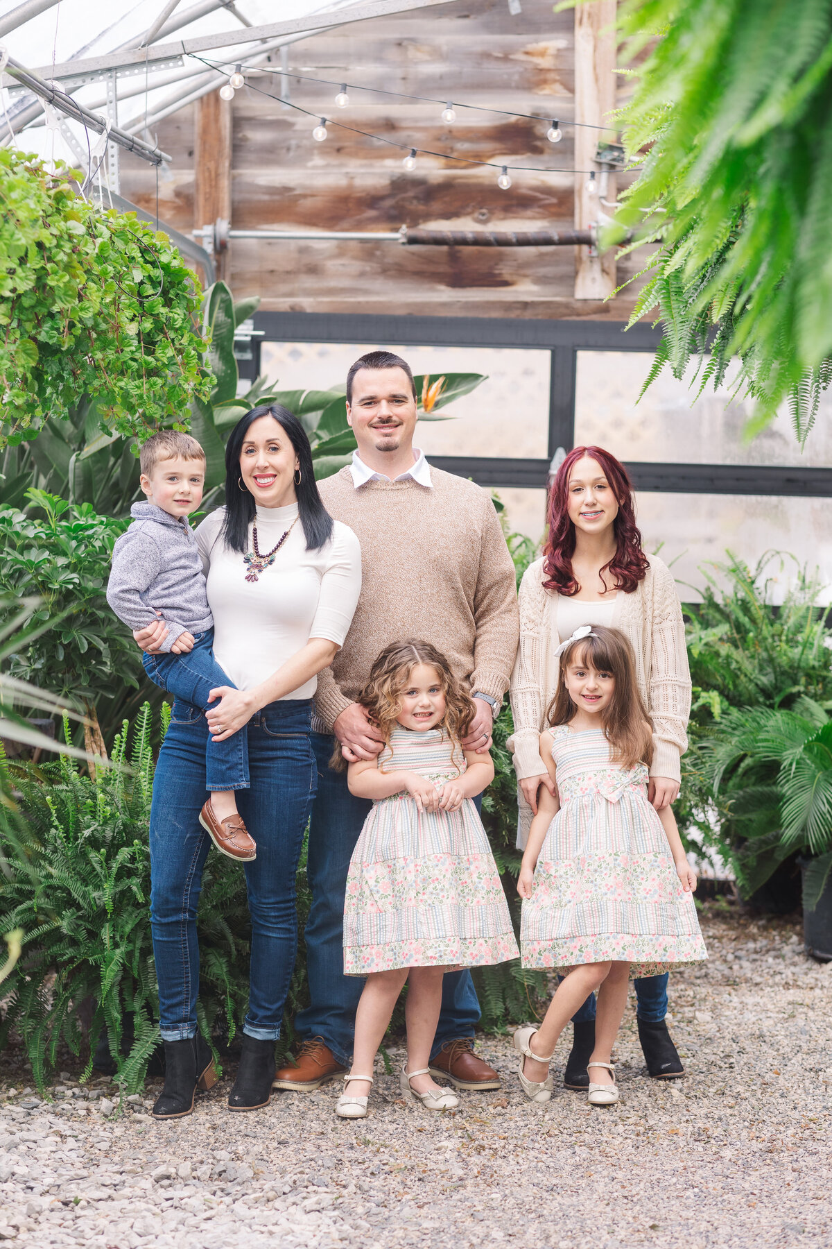 Frozen Moments by Kathy Photography | family portrait  surrounded by greenery